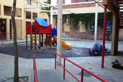 Ramp leading to small, colorful playground