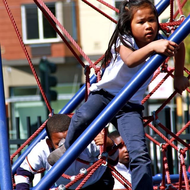 Kids outside on play equipment