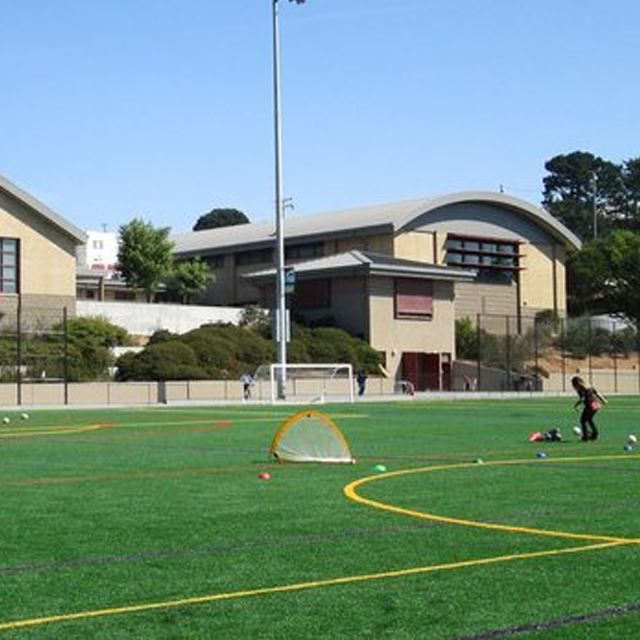 People playing a game on a soccer field