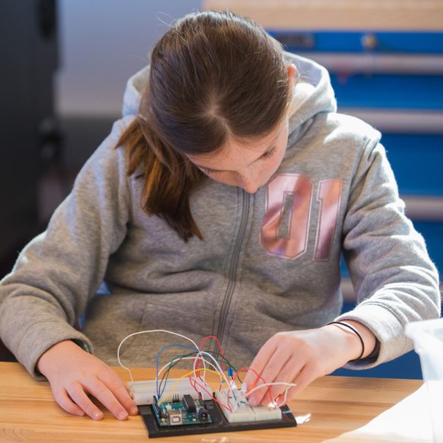 Girl working on electronics project