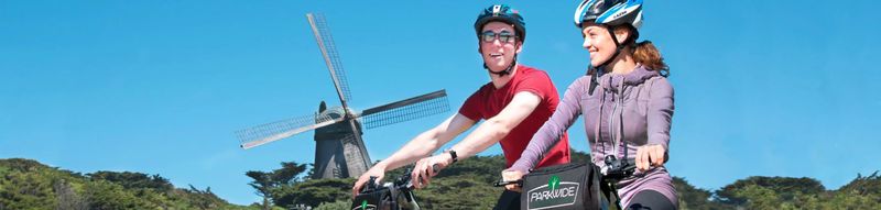 Two people riding bicycles