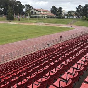 Rows of bleachers overlooking track and field